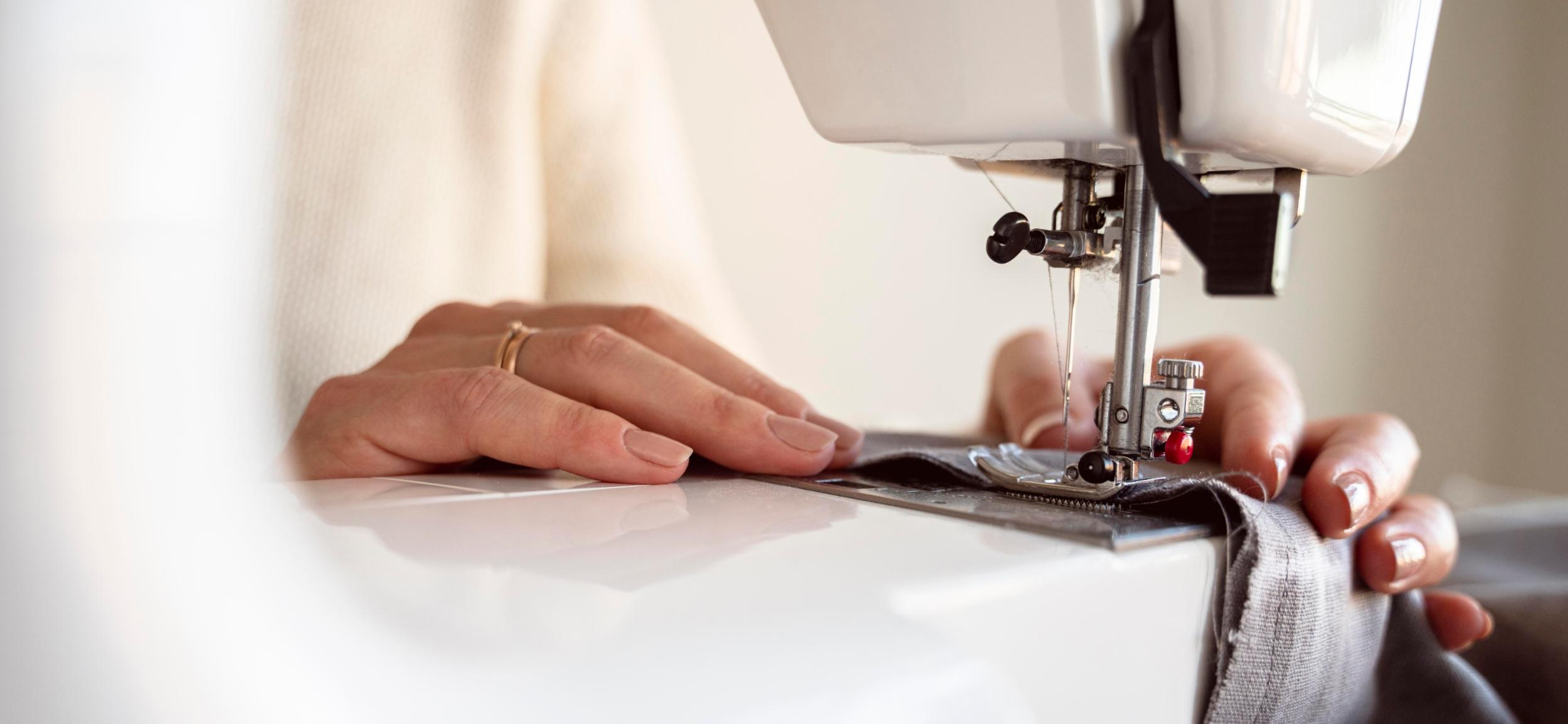 close-up-person-using-sewing-machine