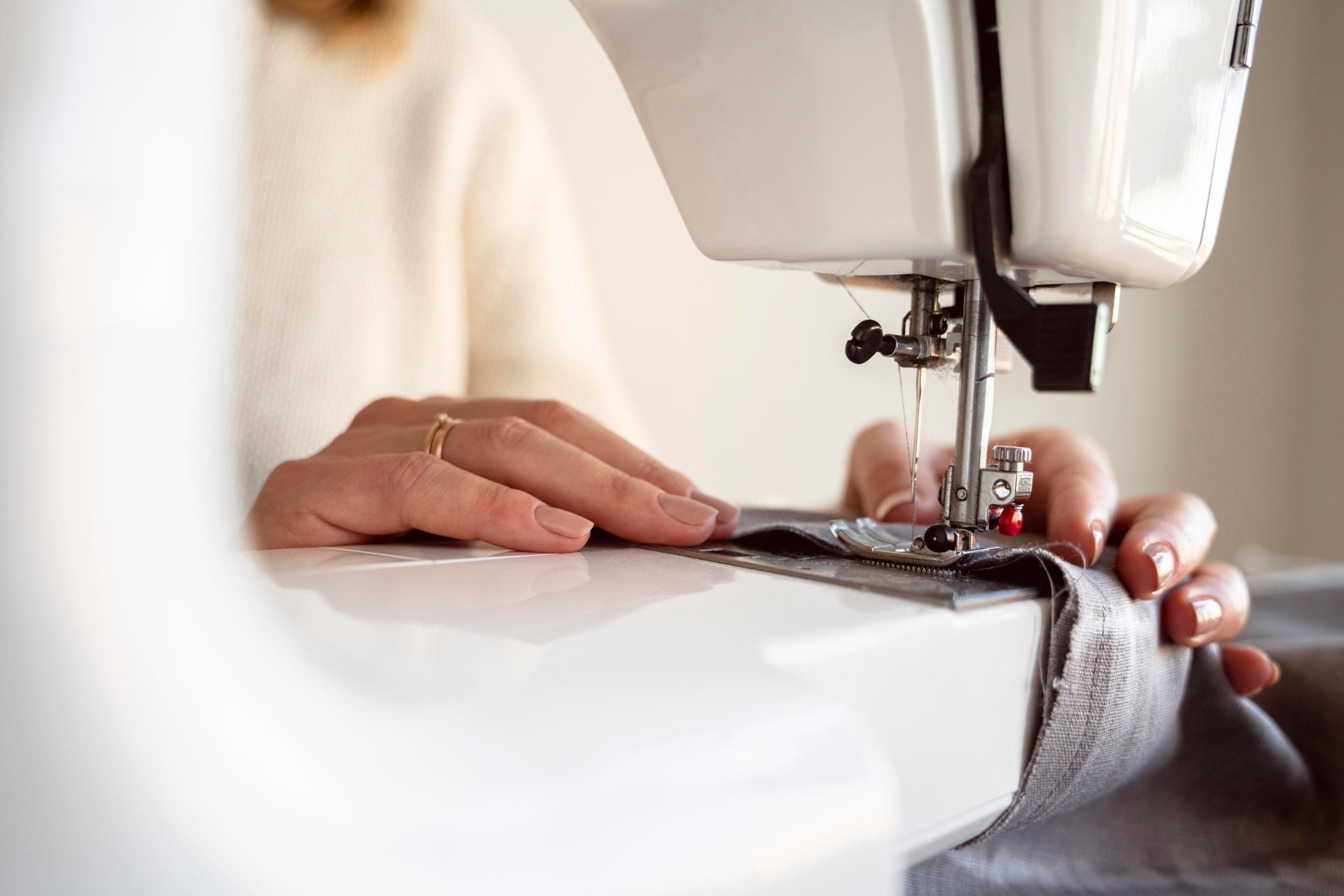close-up-person-using-sewing-machine
