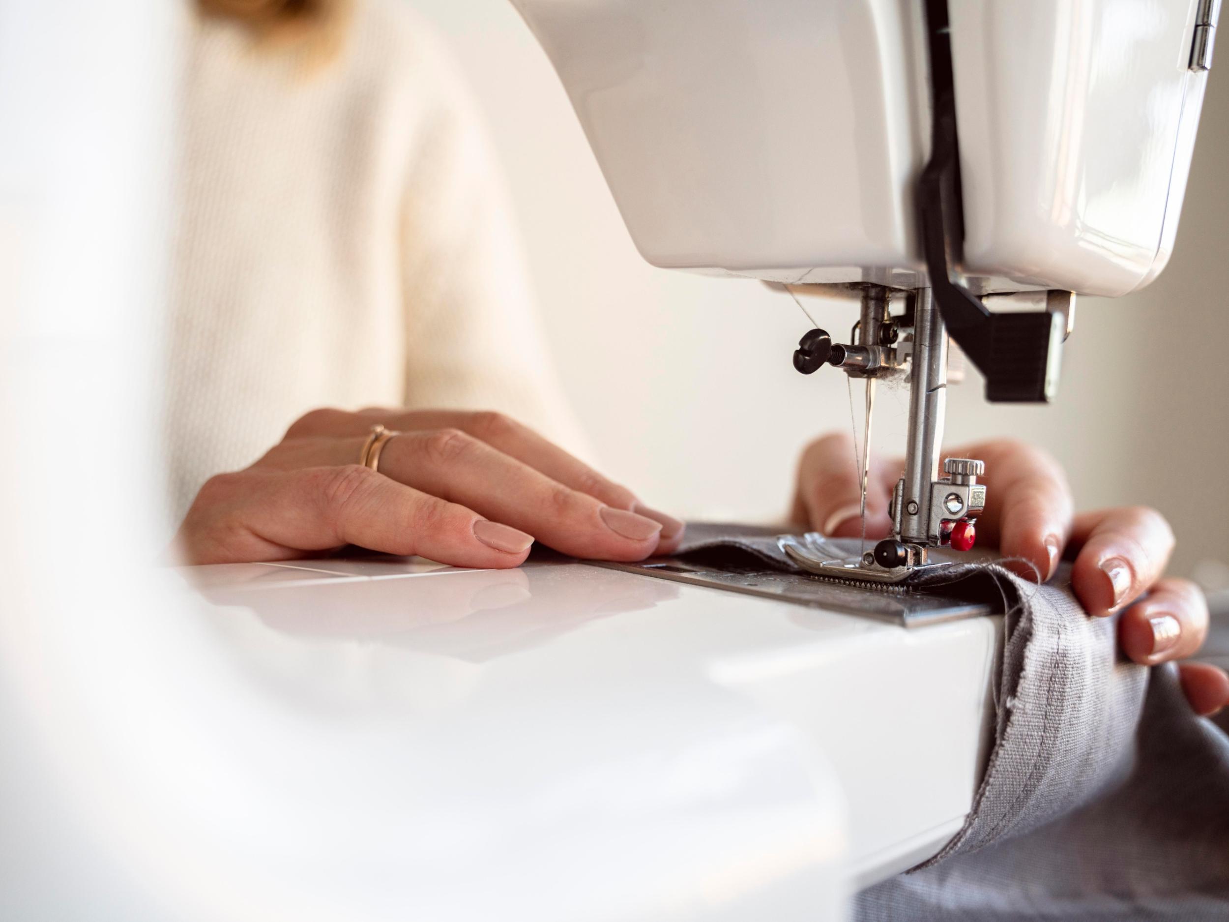 close-up-person-using-sewing-machine