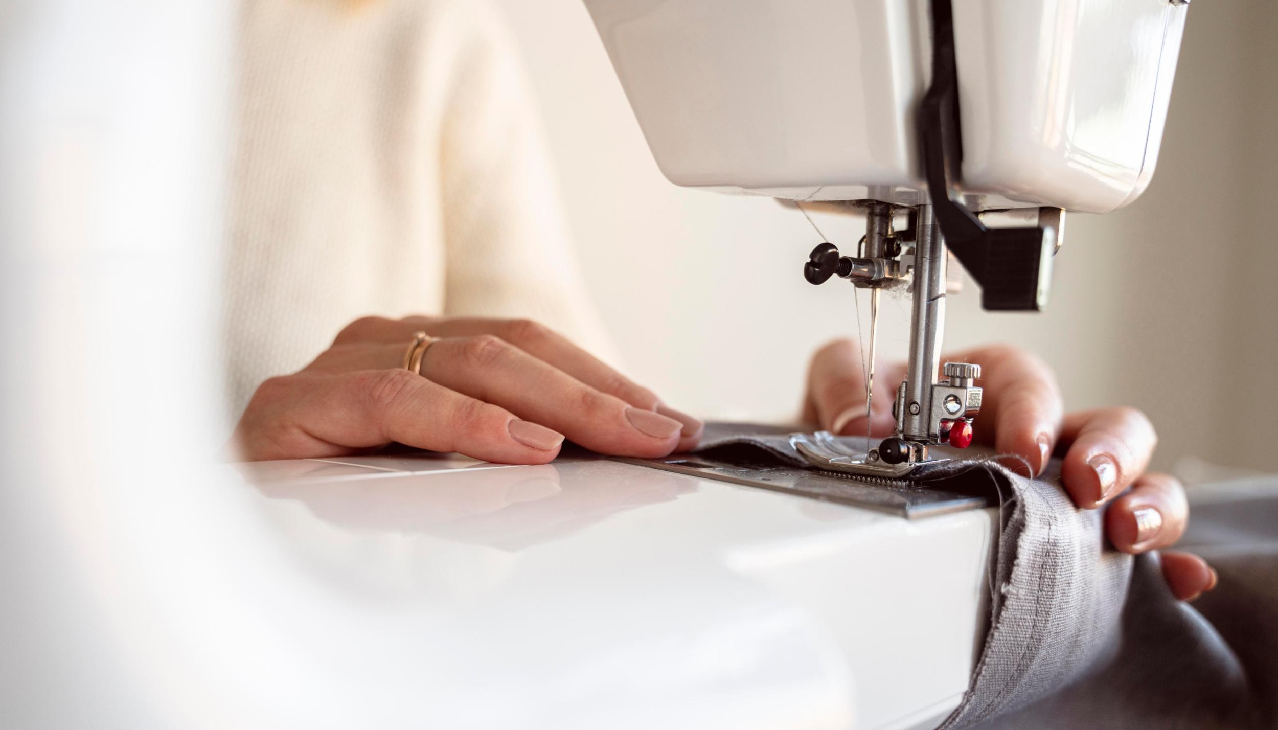close-up-person-using-sewing-machine