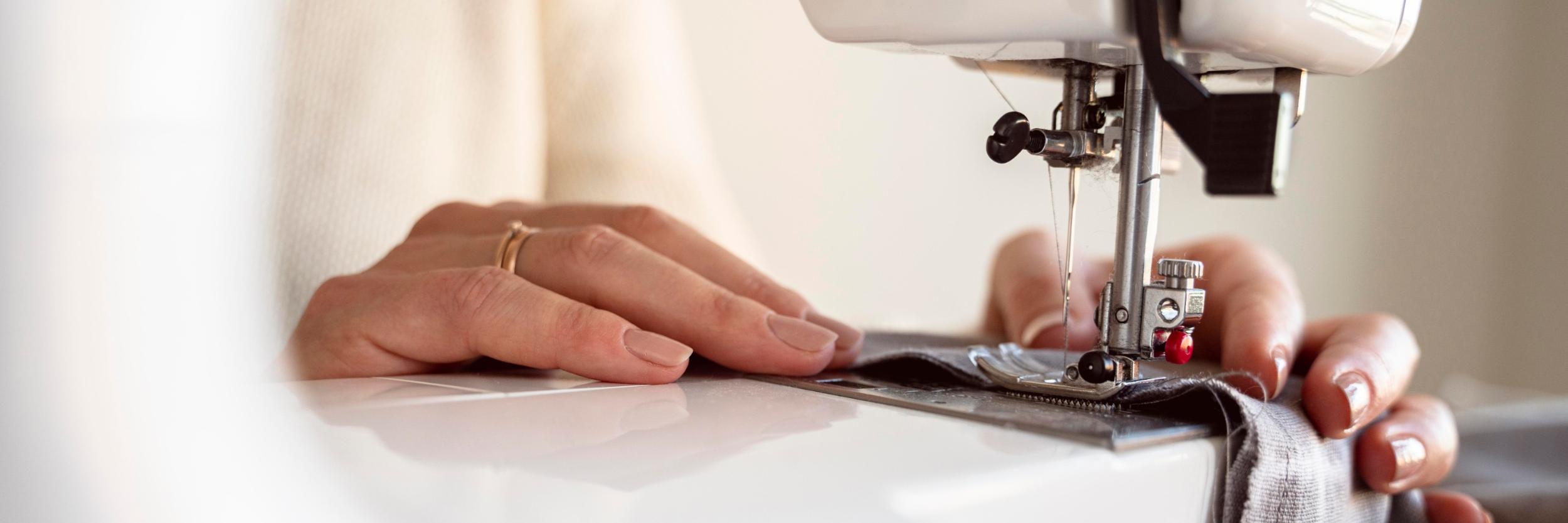 close-up-person-using-sewing-machine