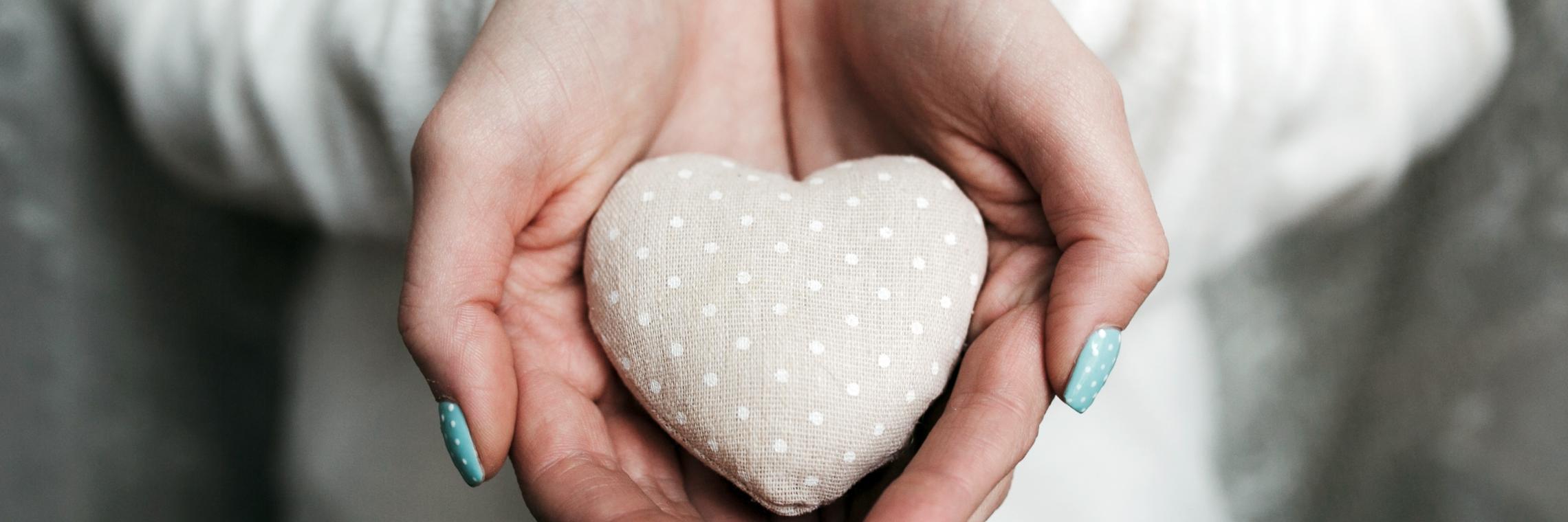 woman-with-heart-shaped-stone-hands